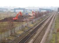 After several false starts work is finally underway on the new Buckshaw Parkway station on the former Royal Ordnance Factory site between Euxton Junction and Chorley, seen here on 16 March 2011. In addition to the industrial units there are now over 1800 houses off to the left with more being built. To the right is part of Runshaw College. Further info about the station and village itself is available on the web. [See image 20909]<br><br>[John McIntyre 16/03/2011]