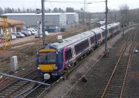 The overhead wires at this location are a bit of a hindrance to <br>
photography, but I suppose we mustn't be selfish. 170459 comes off the Newcraighall line (rump of the Waverley Route) on 16 March with a crossrail service for Glenrothes. Meanwhile a 322 heading for North Berwick retreats slowly, in the wake of the daily 'Binliner' from Powderhall Refuse depot. Typically I failed to photograph either of those two thanks to lateness and camera-faffing respectively. It's not just you.<br>
<br><br>[David Panton 16/03/2011]