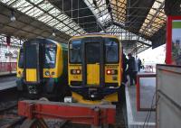 Two units stand in the south east bay platforms at Crewe on 12 March <br>
2011. On the left London Midland 350254 awaits a trip to Northampton while on the right East Midlands 153355 is loading rapidly as football supporters from Chesterfield arrive back at the station from the ground next door. Total attendance at the match had been around 4,500 and many had chosen to travel by train. The result was that the 1707 hrs to Derby was rather...errrr <I>'cosy'</I>. <br>
<br><br>[John McIntyre 12/03/2011]