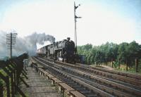 Looking north from the down platform at Dalmeny station in August 1959 as 76114+45115 double head an approaching train off the Forth Bridge. <br><br>[A Snapper (Courtesy Bruce McCartney) 08/08/1959]