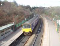 The lines from Sheffield to Barnsley and to Swinton diverge at Meadowhall and with the construction of the nearby shopping centre, and the tram link, it is now a busy four platform interchange station. Northern Sprinter 150138 is taking the Barnsley line with a Huddersfield service and has just pulled away from the sharply curved Platform 4.<br><br>[Mark Bartlett 19/03/2011]