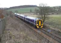 A 4-car 158 set approaches Markinch with an Inverness to Edinburgh <br>
service on 19 March. The rear of the train is passing the crossover <br>
once used for reversing by the hourly terminating service from <br>
Edinburgh. It doesn't see much use since the service pattern changed and Markinch lost its terminating trains, though there are more through services. Note the HST car stop sign way off the end of the platform. Markinch has had an HST service (by Virgin) though three other Fife stations with the 'stranded H' never have.<br>
<br><br>[David Panton 19/03/2011]