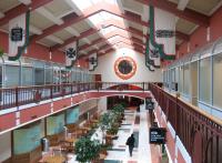 View from the mezzanine level of Chicago's former Dearborn station on 23 March 2011, looking back towards the main entrance underneath the clock. The flags commemmorate the various railroad companies that once used the station, which finally closed in 1971 [see image 33315].<br><br>[Mark Poustie 23/03/2011]