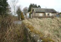 View towards Coulter station on 21 March 2011 from the eastern abutment of the former viaduct that brought the line over the Clyde. As well as the building, a section of platform still survives on the other side of the minor road.<br><br>[John Furnevel 21/3/2011]