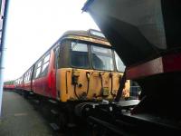 The last surviving class 303 set, no 303 032, awaiting a move to new indoor accommodation, stands in the yard at Boness on 25 March 2011. The tenth anniversary of the type becoming extinct in mainline service will occur in December of next year.<br>
<br><br>[John Yellowlees 25/03/2011]