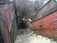 These steps down to what was the north platform at Crookston have not seen a passenger since 1983 when the line to Kilmacolm closed. Since reopening in the 1990s the former westbound platform handles trains between Glasgow and Paisley Canal in both directions. <br><br>[David Panton 26/03/2011]