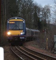 Dusk begins to fall at Perth on 26 March as 170430 passes Barnhill and approaches the Bridge over the Tay with the 16.37 Aberdeen - Glasgow Queen Street.<br><br>[Brian Forbes 26/03/2011]