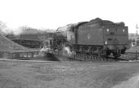 V2 2-6-2 no 60919 on the turntable at Ferryhill shed, Aberdeen, in the 1960s, with A4 Pacific no 60007 <I>Sir Nigel Gresley</I> standing in the background.<br><br>[Robin Barbour Collection (Courtesy Bruce McCartney) //]