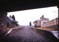 Easter 1966, just two years after closure, with the track not long lifted, but the former Comrie station is already showing signs of decay. Originally part of the Caledonian Railway route from Perth through Crieff to Balquhidder on the Callander & Oban line, from 1951 to its July 1964 closure Comrie was the terminus of the 15-mile branch line from Gleneagles.<br><br>[Frank Spaven Collection (Courtesy David Spaven) //1966]