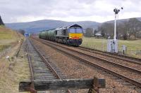 DRS 66413 heads south from Blackford with eight TTA tanks on 28 March. [Subsequently established that the train is the 6D50 Inverness - Mossend (MO) empty tanks, a new service, presumably originating at Lairg.]<br>
<br><br>[Bill Roberton 28/03/2011]