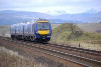 170 419 nears Blackford on 28 March with a Glasgow Queen Street - Aberdeen service. Stuc a'Chroin and Ben Vorlich dominate the background.<br><br>[Bill Roberton 28/03/2011]