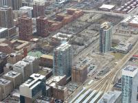 View south-east from the 103rd floor of Chicago's Willis Tower on 24 March showing the throat of LaSalle Street Station, bottom right. Also in the photograph is the former Dearborn Station (the red brick clock tower and green roof) in the centre left of the photograph. Dearborn closed in 1971 and the area once occupied by the platforms and approach tracks is now occupied by Dearborn Park and low-rise housing.<br><br>[Mark Poustie 24/03/2011]