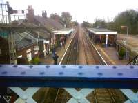 In Norfolk, XXX is more likely to mean Extra Strong Mints than Vin Diesel. This station is gloriously 'messy': I can see six levels of roof on the left. View towards Norwich on 5 March 2011.<br><br>[Ken Strachan 05/03/2011]