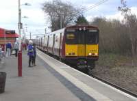314 210 with a service for Glasgow via Maxwell Park calls at Burnside on 26 March 2011.<br><br>[David Panton 26/03/2011]