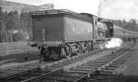 The SLS/MLS <I>Carlisle Railtour</I> of 6 April 1963 at Langholm behind peserved ex-NBR 4-4-0 no 256 <I>Glen Douglas</I>.<br><br>[K A Gray 06/04/1963]