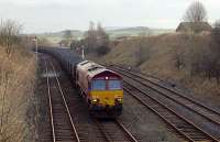 6615x takes the Carlisle route at Settle Junction. The Carnforth route is to the right. View looks east on the 12th of March, 2002.<br><br>[Ewan Crawford 12/03/2002]