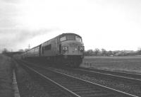On Christmas Eve 1968 the 1S22 09.50 St Pancras - Edinburgh Waverley is photographed heading north shortly after departing from Carlisle behind the usual 'Peak' type 4 locomotive. The train is seen at Stainton Crossing as the light starts to fade.<br><br>[K A Gray 24/12/1968]