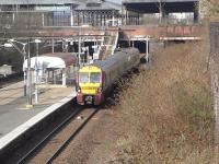 Spring sunshine and the birds are twittering in Dennistoun on the <br>
morning of 26 March as 334 030 calls at Bellgrove, heading east.�The<br>
fact that it's a 334 means it's more likely to be an Edinburgh service than a local and indeed it is.<br>
<br><br>[David Panton 26/03/2011]