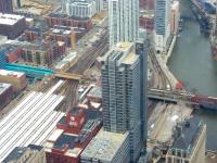 View northwest from the Willis Tower showing what is now the Ogilvie Transportation Center, which replaced the former Chicago & North Western Railroad's Chicago and North Western Terminal, built in 1911. The new station was opened in 1987 and renamed the Ogilvie Transportation Center 10 years later. It is used by the Metra commuter rail system's Union Pacific West, North and Northwest routes. The tracks further to the right adjacent to the Chicago River are the tracks leading north from Union Station in the direction of Milwaukee and are used by Amtrak and Metra's Milwaukee District North and West and North Central Service routes.<br><br>[Mark Poustie 24/03/2011]