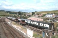 The sidings at Grantshouse on the ECML, located on the site of the former station (closed May 1964) and occupied here by ecs and pw vehicles. Photograph taken in 1979 looking north west towards Edinburgh.<br><br>[Bruce McCartney //1979]