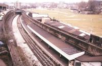 View south east over the platforms at Shoreditch in July 1985 looking towards Whitechapel. The former northern terminus of the East London Line closed in June 2006. The station has since been demolished and the cutting filled in. Today an elevated route runs past on the left to cross the GE main line before turning north along the trackbed once used by trains from Broad Street to reach the North London Line at Western Junction [see image 5172]. A 'replacement' station opened at Shoreditch High Street on the new alignment in 2010.<br><br>[Ian Dinmore 12/07/1985]