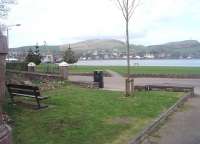 Campbeltown Loch, as seen from the bottom of the old railway cutting where the narrow gauge tracks emerged onto reclaimed land and turned left towards Hall St and the quayside, following the line of the footpath that can be seen here. New Quay, which also had railway tracks on it, can be seen in the left background. [See image 33469] for a map showing the railway layout in 1921. <br><br>[Mark Bartlett 26/03/2011]