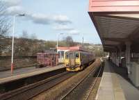 A Calder Valley line service, formed by Leyland unit 155345, calls at Sowerby Bridge on 2 April on its way to Leeds. Above the unit the local landmark, Wainhouse Tower, can be seen. Originally built as a chimney it was turned into an ornate folly and, at 400', is reputed to be the tallest in the world. <br><br>[Mark Bartlett 02/04/2011]