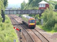 An unusually hot summers day in June 2005 sees an early afternoon Glasgow Queen Street - Dunblane service running north past the tall signal box at Plean, heading for its next stop at Stirling.<br>
<br><br>[John Furnevel 23/06/2005]