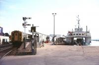 A 4-VEP unit at Lymington Pier station in 1979. Standing at the pier is the 'Wightlink' ferry <I>Cenwulf</I>, operating between Lymington and Yarmouth, Isle of Wight.<br><br>[Ian Dinmore //1979]