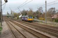 Northern Pacer 142004 heads south on the Up Fast at Euxton on <br>
31 March 2011, although failing to reach or even come close to achieving linespeed. The appearance of these units on the Fast Lines of the 4 track section here is unusual, possibly just as unusual as seeing a unit head south with 'Preston' on the destination board but this was an ecs move so perhaps that was the excuse. The rear destination board was however displaying 'Wigan Wallgate' so it is anyones guess where the unit was actually going!<br>
<br><br>[John McIntyre 31/03/2011]