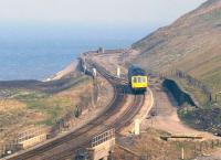 A DMU skirts the Cumbrian coast at Parton, between Workington and Whitehaven, in May 1990. <br><br>[Ian Dinmore /05/1990]