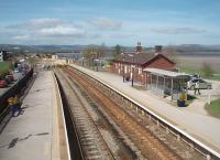 With the viaduct closed from March to July 2011 for renewal of the decking, Arnside station has become a temporary terminus. The contractor's site can be seen behind the buffers and fence built across the line and services from Carnforth are running wrong line  to here before returning south. [See image 31078] for the same view seven months earlier. <br><br>[Mark Bartlett 07/04/2011]