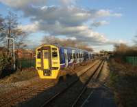 158905 forming a Blackpool North - York service, seen under a dramatic sky on the early evening of 10 February 2011. The train is eastbound through Lostock Hall on the approach to Lostock Hall Junction.<br><br>[John McIntyre 10/02/2011]