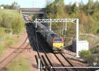 67024 arriving at Millerhill with empty stock on the morning of 12 April 2011 has just passed the 10.05 service to Waverley standing at the platform at Newcraighall station in the background. The turnback siding on the left, normally used by trains terminating at Newcraighall, was out of use due to work taking place in connection with the new Borders Railway route to Tweedbank [see image 33608]. <br>
<br><br>[John Furnevel 12/04/2011]