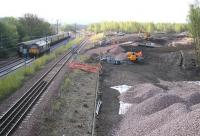 Looking south along the Newcraighall turnback siding towards Millerhill yard on 12 April 2011 with works in connection with the Borders Railway now underway on the right. On the left 67021 is held at signals waiting to head north, with 67024 about to enter the yard with a train of empty stock. For the view forty years earlier [see image 10108].<br><br>[John Furnevel 12/04/2011]