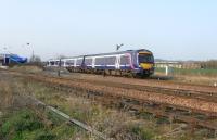 170 450 pulls out of the rather exposed station at Leuchars with an <br>
Inverurie service on 9 April. Notice that despite this being an island station the the platforms don't end together. This isn't compensated for at the southern end: in fact it's repeated making the Up platform a fair bit shorter than the Down. It's still big enough for the longest service trains, but you do wonder what they had in mind here.<br><br>[David Panton 09/04/2011]