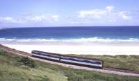 The Cornish coast around Carbis Bay, photographed in the summer of 1999, with a DMU passing along the St Ives branch bound for St Erth and the junction with the Great Western main line.<br><br>[Ian Dinmore 21/06/1999]