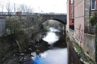 An outer circle service train draws to a halt at Pollokshaws East. The view is from Kilmarnock Road and looks west. [See image 7360] for the same view 24 years earlier.<br><br>[Ewan Crawford 27/03/2011]