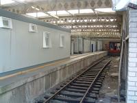 We seem to be doing a series of photographs of unloved platforms at the moment. So, here's a shot of platform 6 at Wolverhampton (High Level, er obviously). Those cabins may make alighting a little tricky. 14 July 2003.<br><br>[Ewan Crawford 14/07/2003]