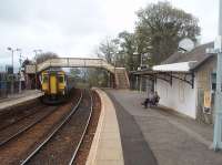 156512 leaves Busby on a Glasgow service on 14th April. This was the eve of the 45th anniversary of the last steam train on this line [See image 46728] and I know that the gent waiting for the approaching East Kilbride Sprinter was ruefully wishing it was a 2-6-4T for the climb to the terminus.<br><br>[Mark Bartlett 14/04/2011]