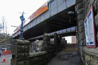 The entrance to Pollokshaws East on Kilmarnock Road is quite a grand affair, even with the lamp missing from the lampholder. Two castellated sets of steps climb to the entry stairway.<br><br>[Ewan Crawford 27/03/2011]