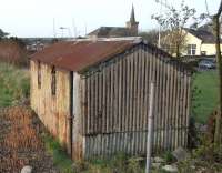 This relic of bottom-end railway architecture looks like something <br>
you'd come across on a long-lifted branch. In fact it's just off the Down platform at Kirkcaldy in April 2011. My guess is that it was an inflammables store (oil for signal lamps?) placed just far enough out of harms way, and that it's never been worth the cost and bother of removing it. <br>
<br>
<br><br>[David Panton 09/04/2011]