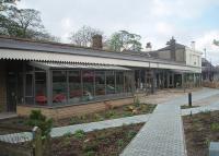 Longridge station, transformed into a thriving cafe and community centre, which also has railway memorabilia and historic photos. A replica canopy has been installed and behind the glass seating areas the original stone building and offices survive. [See image 33686] for the same location in 1967.<br><br>[Mark Bartlett 16/04/2011]