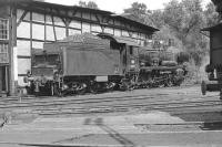 The last ex-KPEV (Royal Prussian Railway) P8 4-6-0 working on the Deutsche Bundesbahn, No 038 772, stands alongside the half roundhouse at Rottweil Shed in the Black Forest in September 1974, a few monthsbefore it was finally withdrawn from service. If I remember correctlythe loco worked an early morning local passenger train to Tuttlingenand back and then spent the rest of the day sitting on shed. It mayhave worked an evening turn as well but my patience ran out beforethen!<br><br>[Bill Jamieson 04/09/1974]