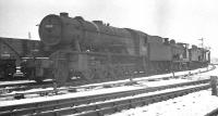 Ex-WD 2-10-0 no 90768 stands in the sidings alongside Carstairs shed on a cold February day in 1963, some 7 months after its official withdrawal. The locomotive was eventually cut up at Darlington Works in December of that year.<br><br>[K A Gray 02/02/1963]