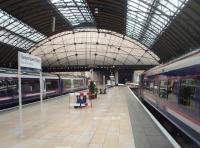 Even with the tunnels immediately off the end of the platforms there is a light and airy feel to Queen Street station, greatly assisted by the light coloured floor tiles. 170401, newly arrived, sits alongside 158738, which is just about to leave on an all stations to Anniesland shuttle service.<br><br>[Mark Bartlett 14/04/2011]