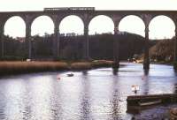 A 2-car DMU bound for Gunnislake crosses the Tamar on Calstock Viaduct in January 1990. The viaduct, built in 1908, carries the railway 120 feet above the river between Bere Alston and Calstock.<br><br>[Ian Dinmore 15/01/1990]