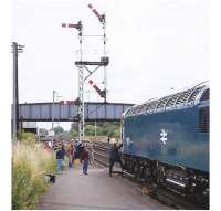 Having deposited passengers off the <I>Melton Mowbray Pieman</I> on 24 July 1977, 56008 is about to take the empty stock to Nottingham. Tour participants, having been handed a pork pie, were then bussed to Stapleford Park for a day's amusement and rejoined the train in the early evening at Leicester for the return to Barnsley.  (Railscot note: The 'ripple-effect' or 'badger's bum' finish on the locomotive panels identifies this as one of the 30 examples of the class built for BR by Electroputere in Romania [see image 20227])  <br>
<br><br>[Bill Jamieson 24/07/1977]