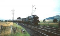 On a September afternoon in 1959 Royal Scot 4-6-0 no 46105 <I>Cameron Highlander</I> is about to run south through Symington station with an up Liverpool service.<br><br>[A Snapper (Courtesy Bruce McCartney) 28/09/1959]