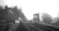 View south over Kershopefoot station on the final Friday, 3 January 1969. Taken from the border, just north of the station. Few signs of the railway remain here today, other than the old station house, part of which can be seen standing at a lower level to the left of the crossing [see image 17732].<br>
<br><br>[K A Gray 03/01/1969]